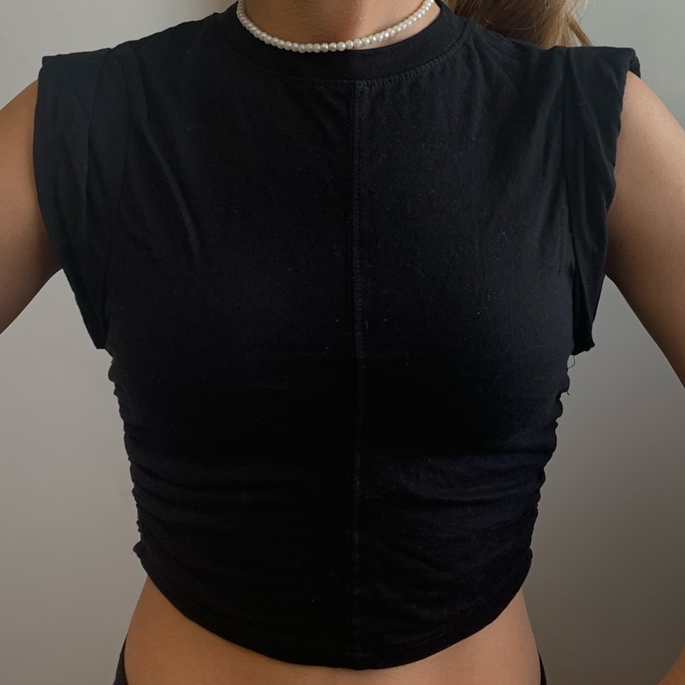 Black crop top with a detail at the side - swipe to see it